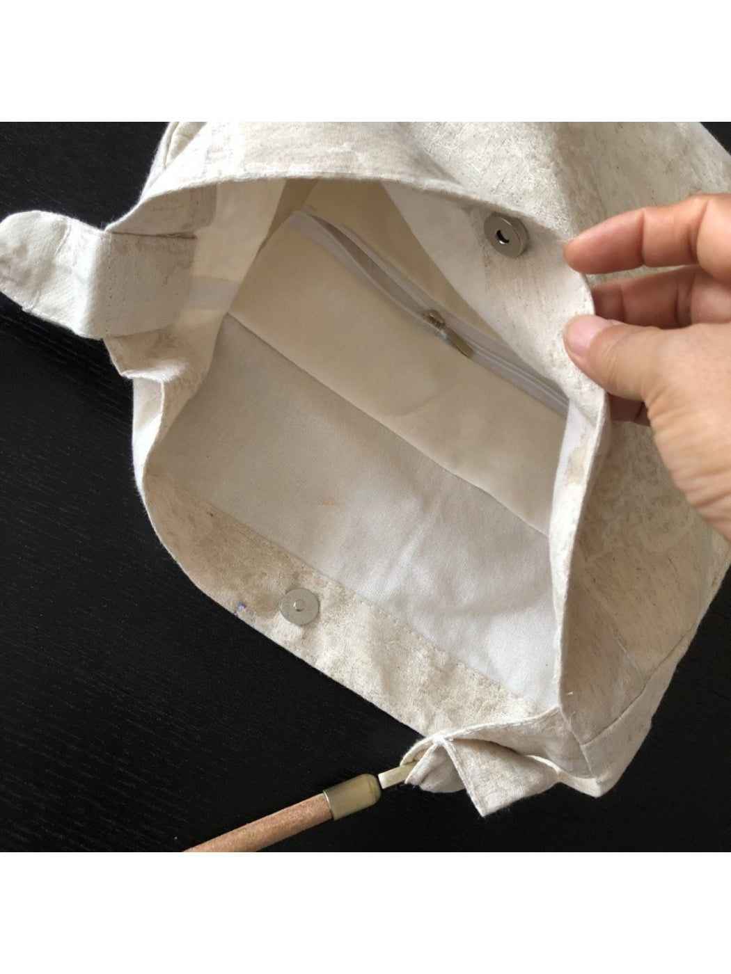 Interior view of ivory hobo bag with spacious and lining