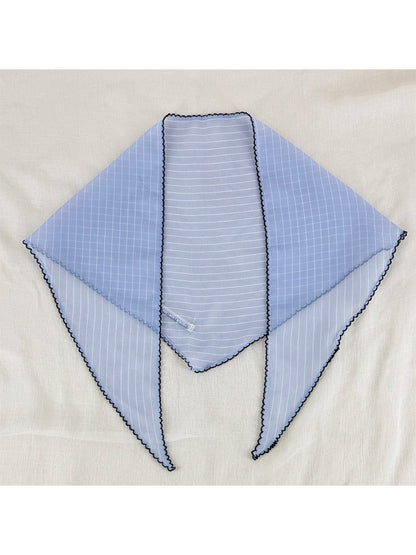 Scarvii pleated scarf draped over shoulder highlighting texture and trim
