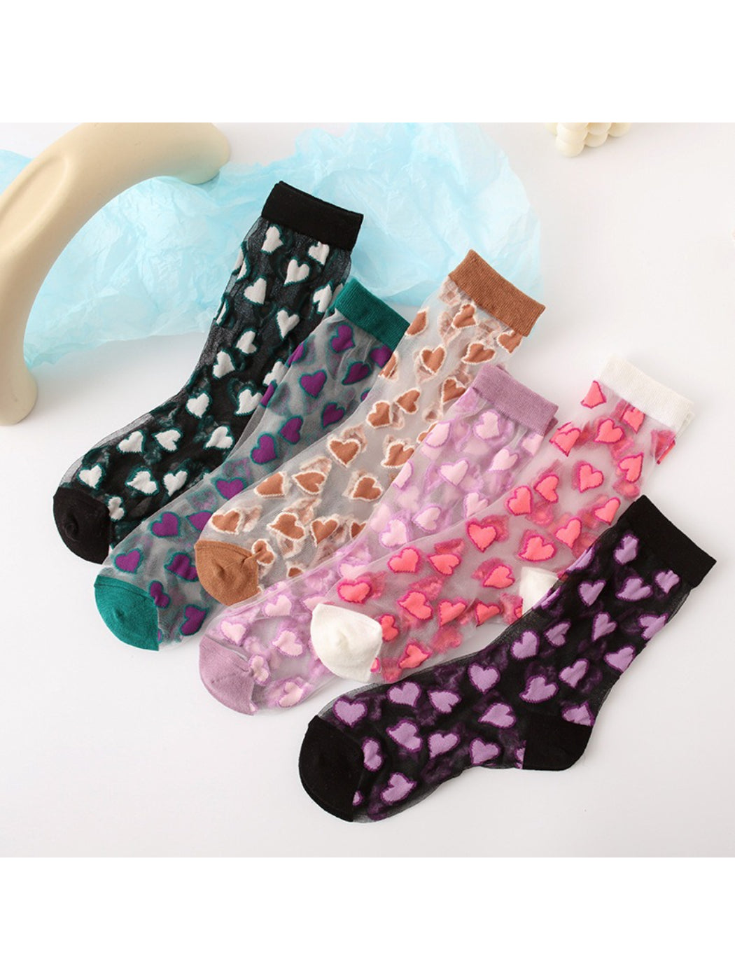 Pair of Rufia Candy Heart sheer crew socks with pastel heart patterns