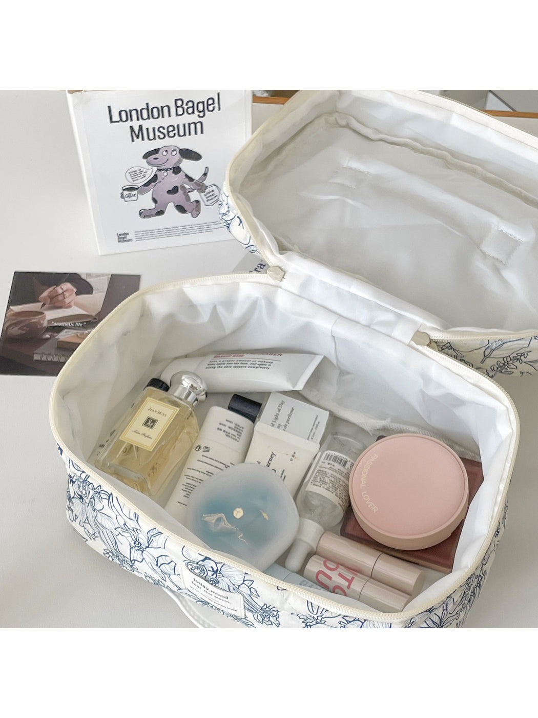 Close-up of botanical floral pattern on Cosbai travel cosmetic bag fabric
