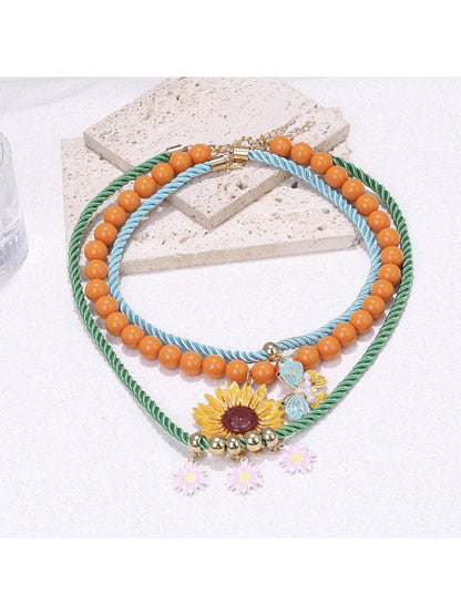 Neckit Sunflower Charm Rope Necklace with detailed floral design on a white background