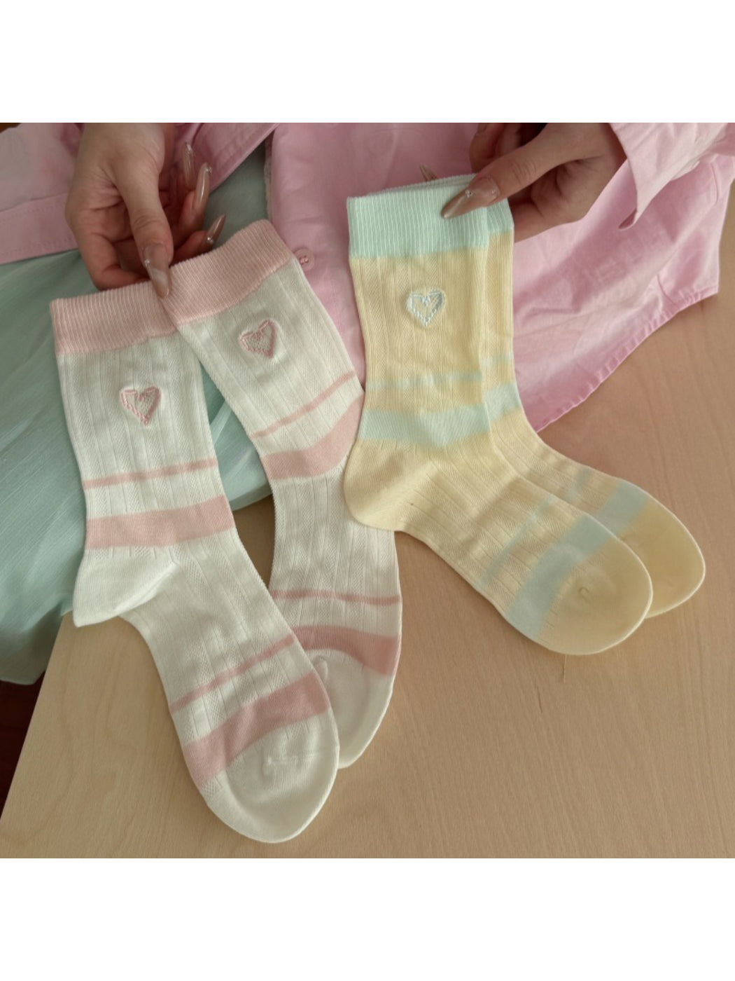 Pair of Rufia soft colourblock socks with heart design in pastel shades