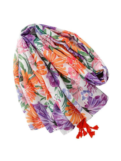 Scarvii Tropical Bloom Tassel Scarf draped over shoulder highlighting lightweight material and floral design