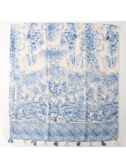 Blue baroque scarf draped over shoulder showing tassels