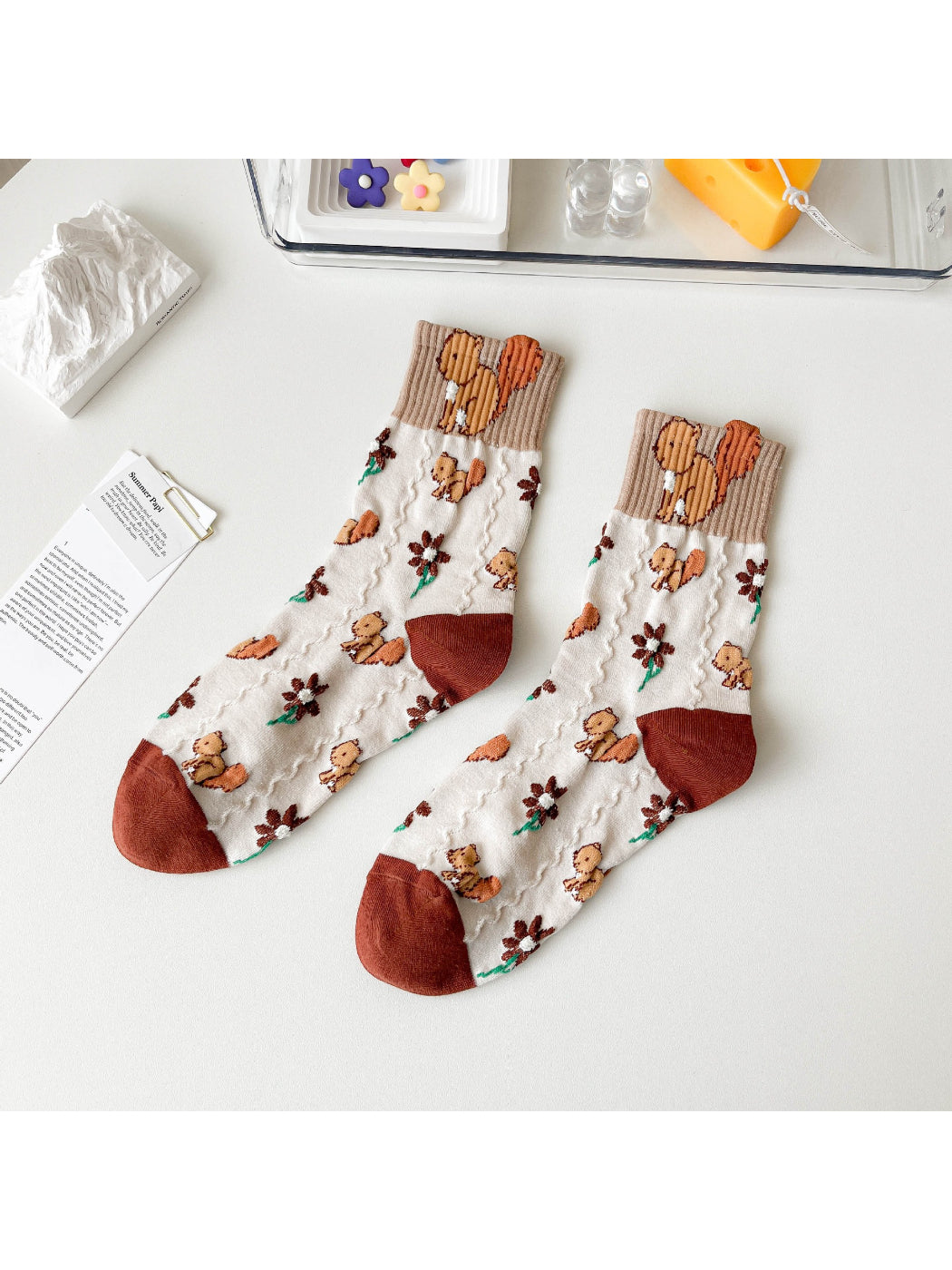Rufia Woodland Bloom socks folded to show the vibrant woodland bloom design