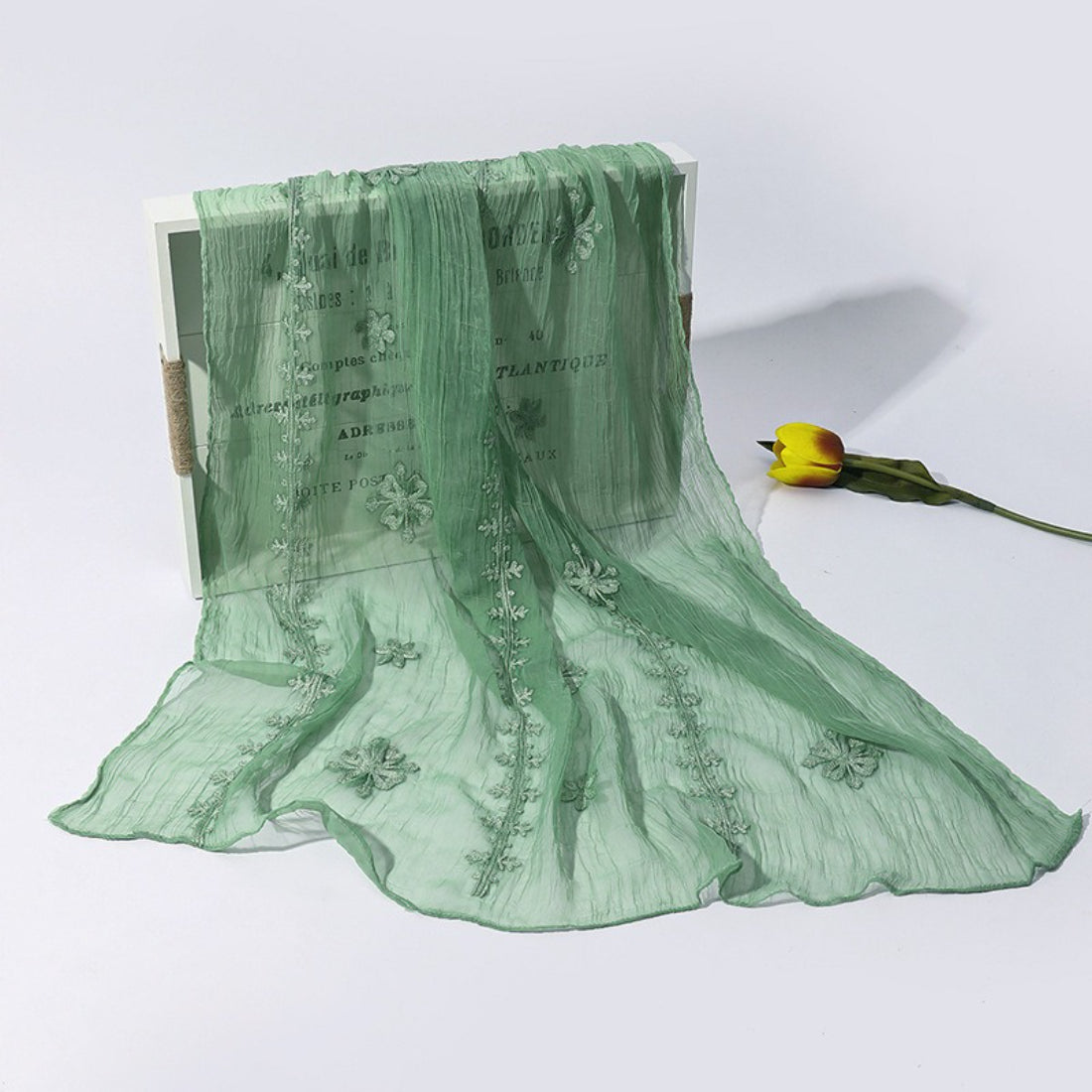 Scarvii lightweight scarf detail showing fine stitching and pastel color palette