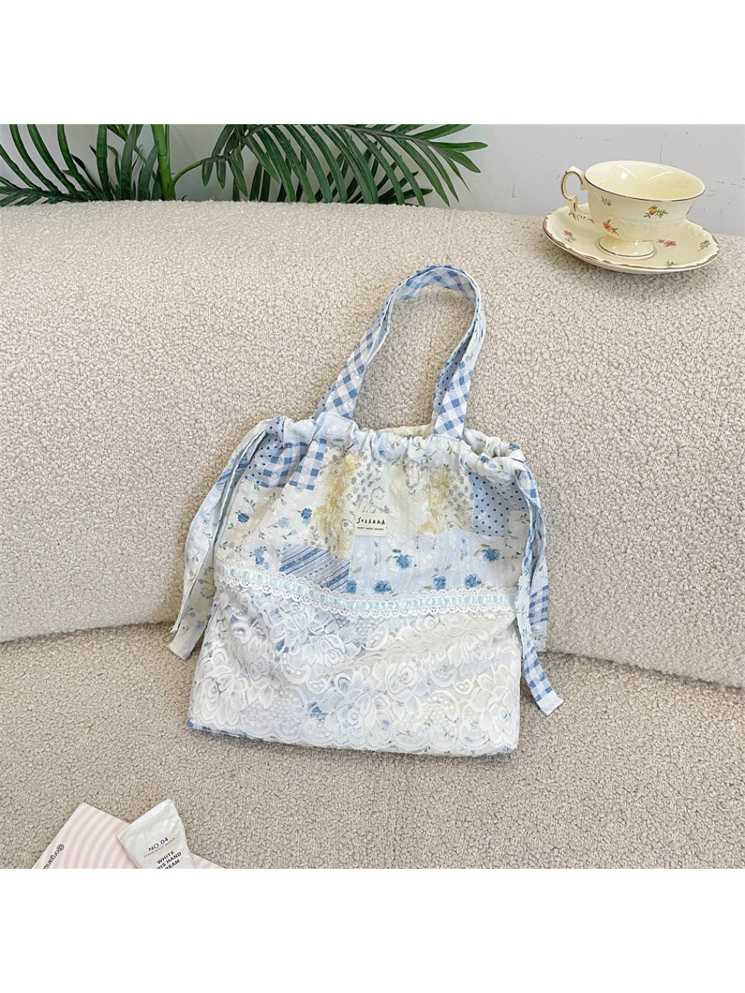 Close-up of lace and patchwork details on Cosbai Romantic Lace Patchwork Shoulder Tote
