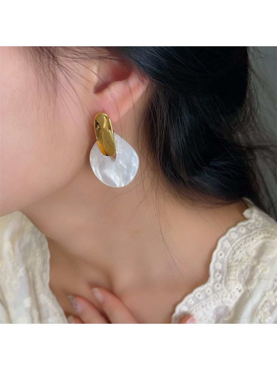 Earwish soft color round drop earrings in pastel green on white background