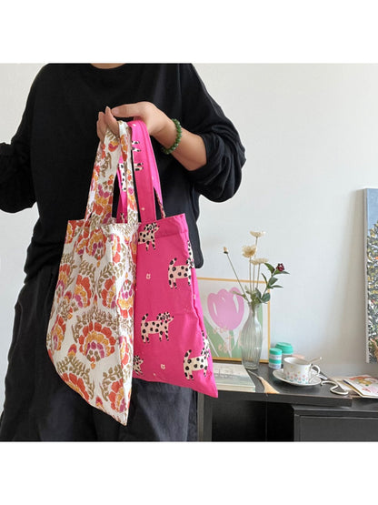 Cosbai printed everyday tote bag folded flat to show compact design