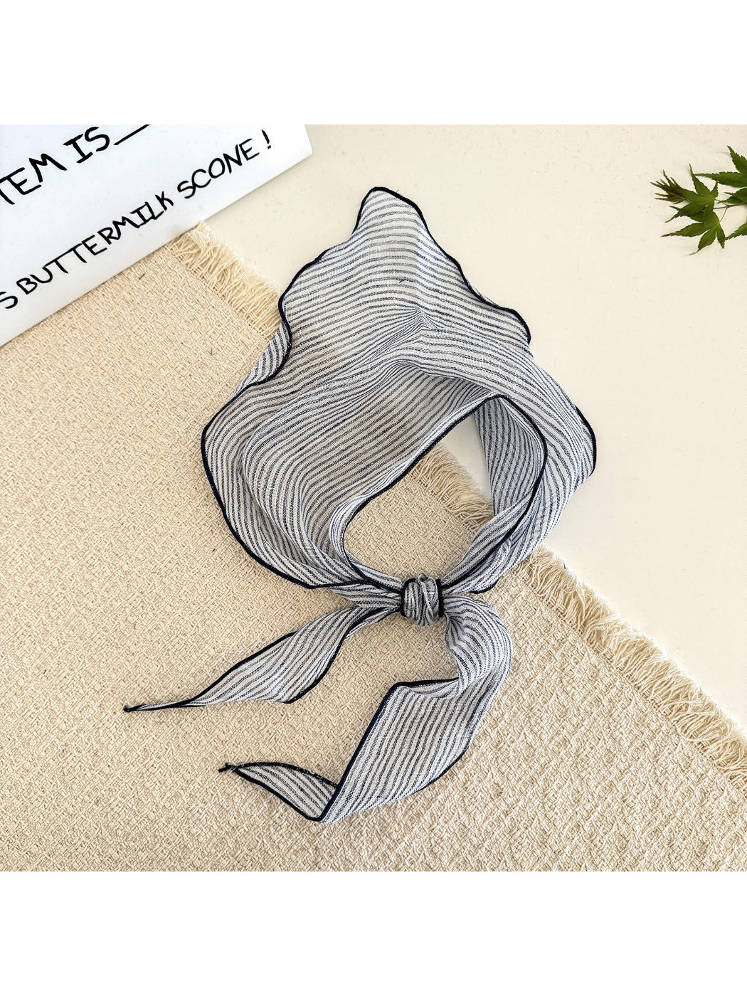 Close-up of soft fabric with horizontal stripes in beige and cream colors