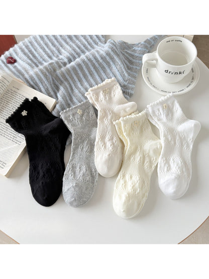 Rufia Sweet Floral Knit Crew Socks in pastel colors displayed flat