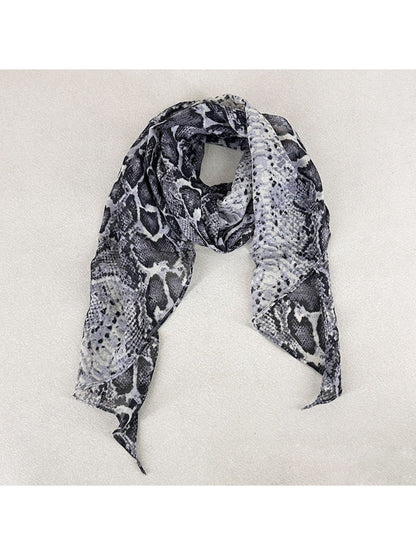 Monochrome snake print scarf folded on a white background