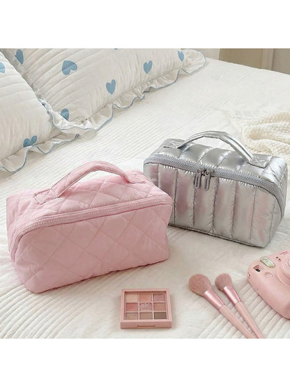 Cosbai portable makeup bag with top handle in a neutral color on a white background