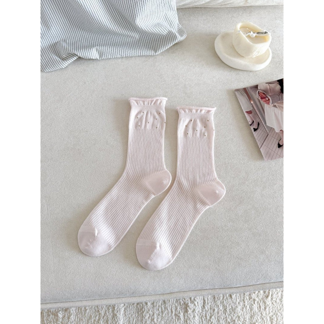 Close-up of the toe and heel area of beige Rufia Everyday Turn Cuff Knit Socks