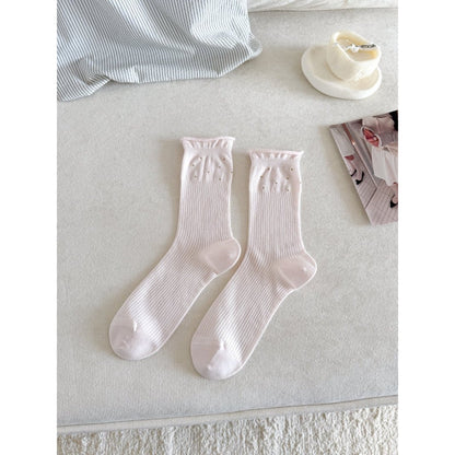 Close-up of the toe and heel area of beige Rufia Everyday Turn Cuff Knit Socks