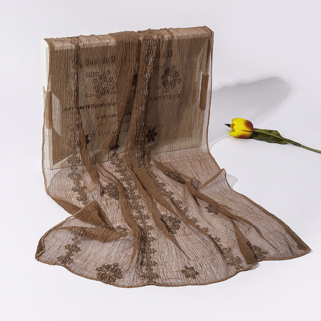 Scarvii lightweight scarf folded to show layered blossom stitch embroidery