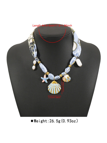 Neckit Botanical Charm fabric necklace laid out showing full length and charm details