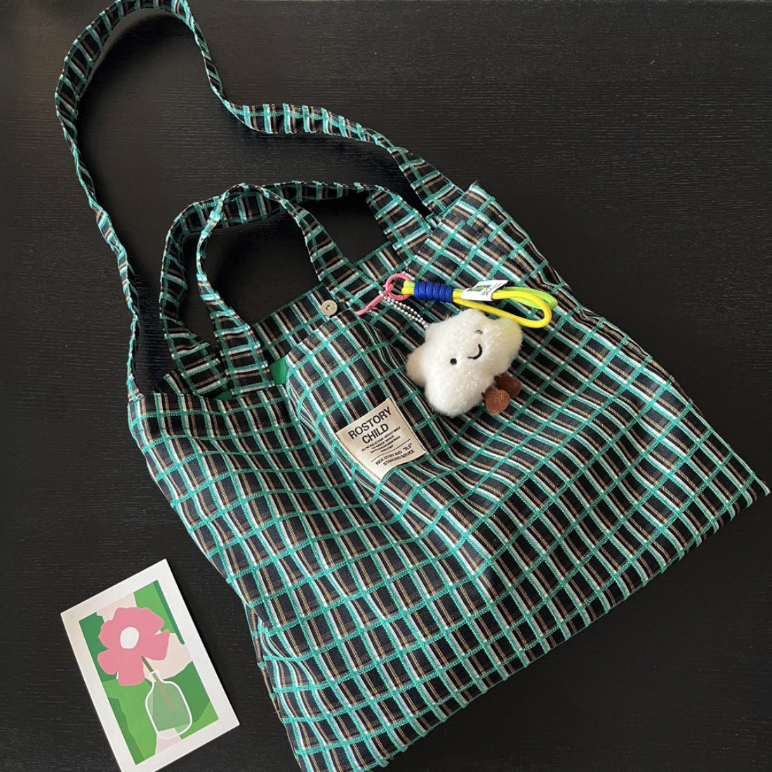 Side view of Cosbai slouchy checked shoulder tote bag showing strap detail