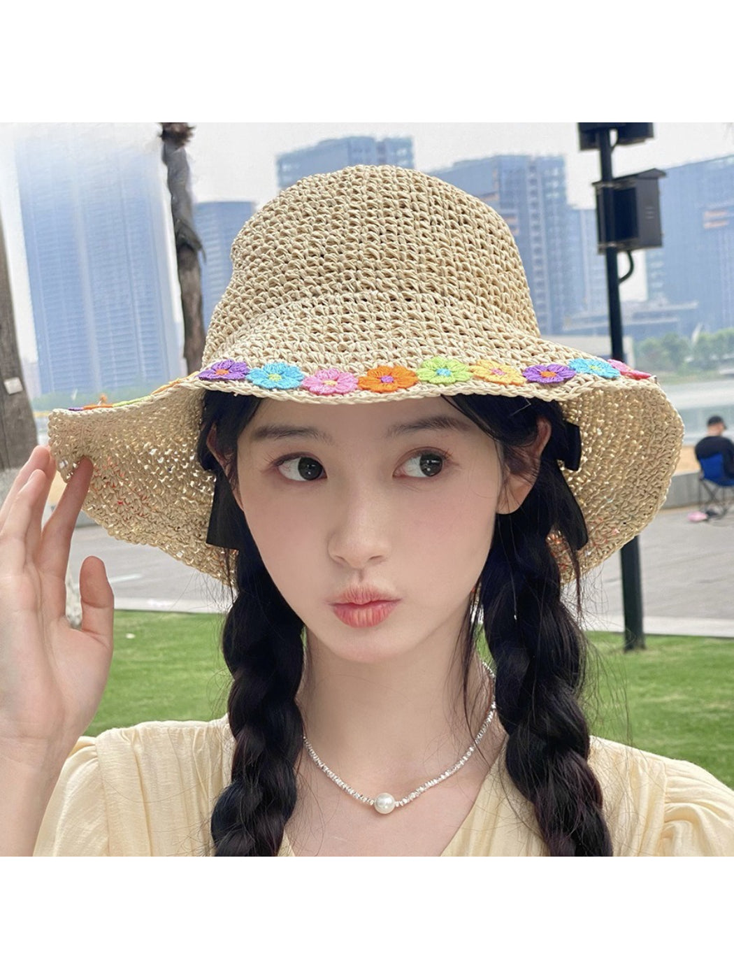 Top view of Haila sun hat highlighting multicolored daisy design on brim