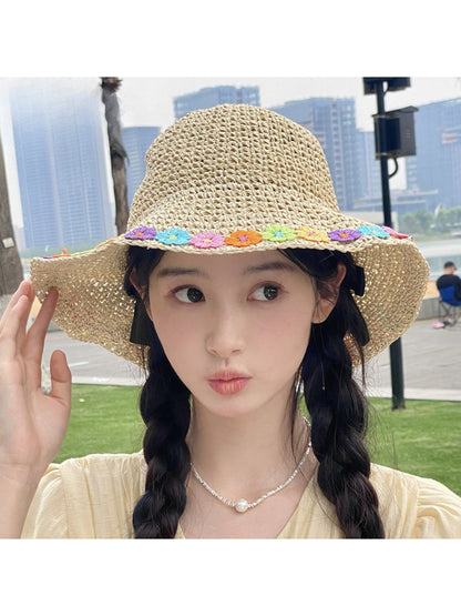 Top view of Haila sun hat highlighting multicolored daisy design on brim