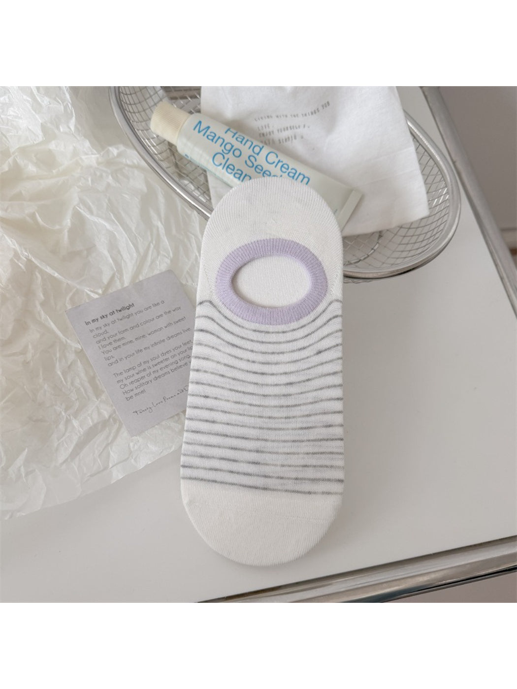 Rufia striped low cut liner socks paired with sneakers on wooden floor