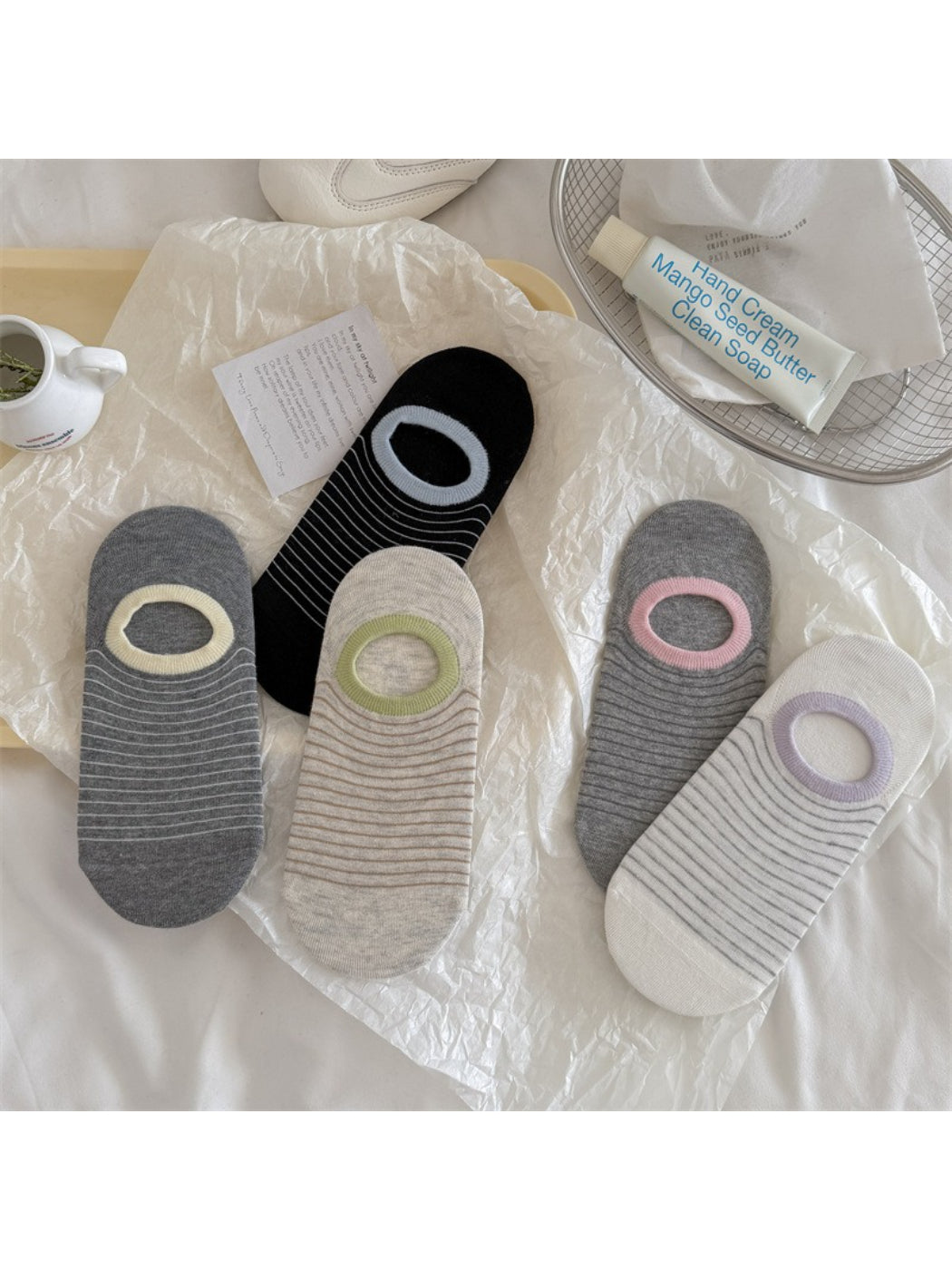 Rufia striped low cut liner socks displayed from side angle highlighting low cut design