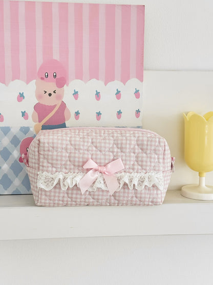 Cosbai cosmetic pouch open with makeup items inside