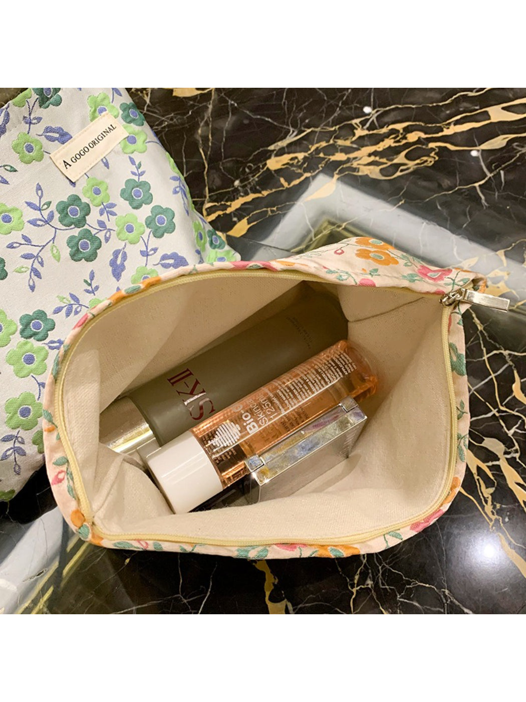 Cosbai 70s inspired floral makeup pouch folded flat highlighting fabric texture