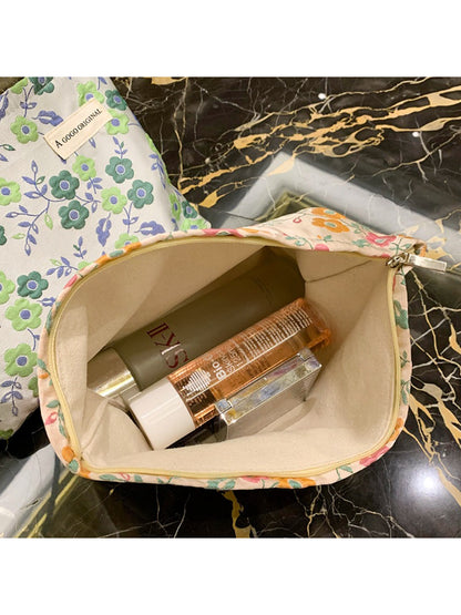 Cosbai 70s inspired floral makeup pouch folded flat highlighting fabric texture