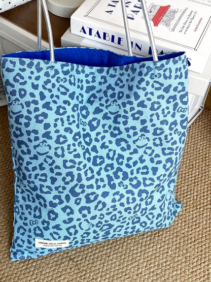 Cosbai leopard print tote bag folded flat to demonstrate lightweight design
