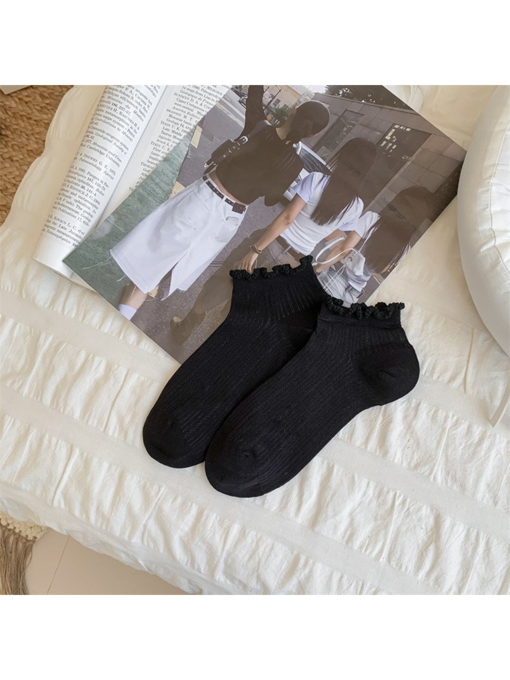 Rufia ankle socks worn on feet, highlighting bobble trim and ankle height