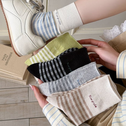 Pair of Rufia casual fine stripe crew socks in neutral colors displayed flat