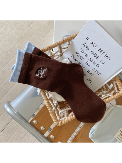 Side view of Rufia socks showing floral pattern wrapping around