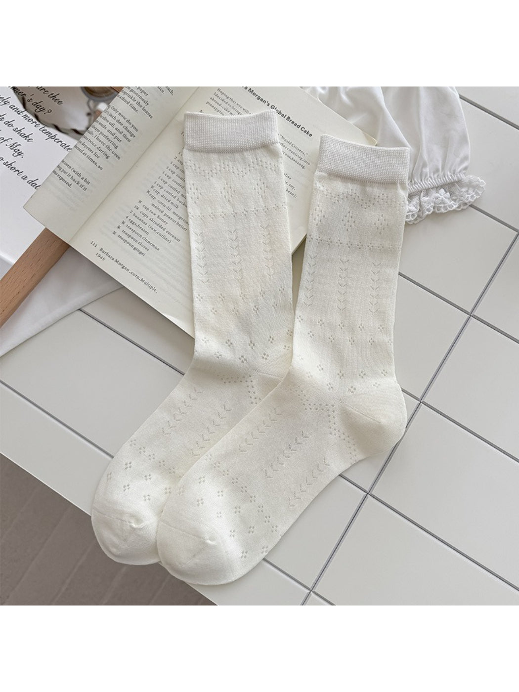 Rufia soft pointelle socks folded neatly with visible knit details