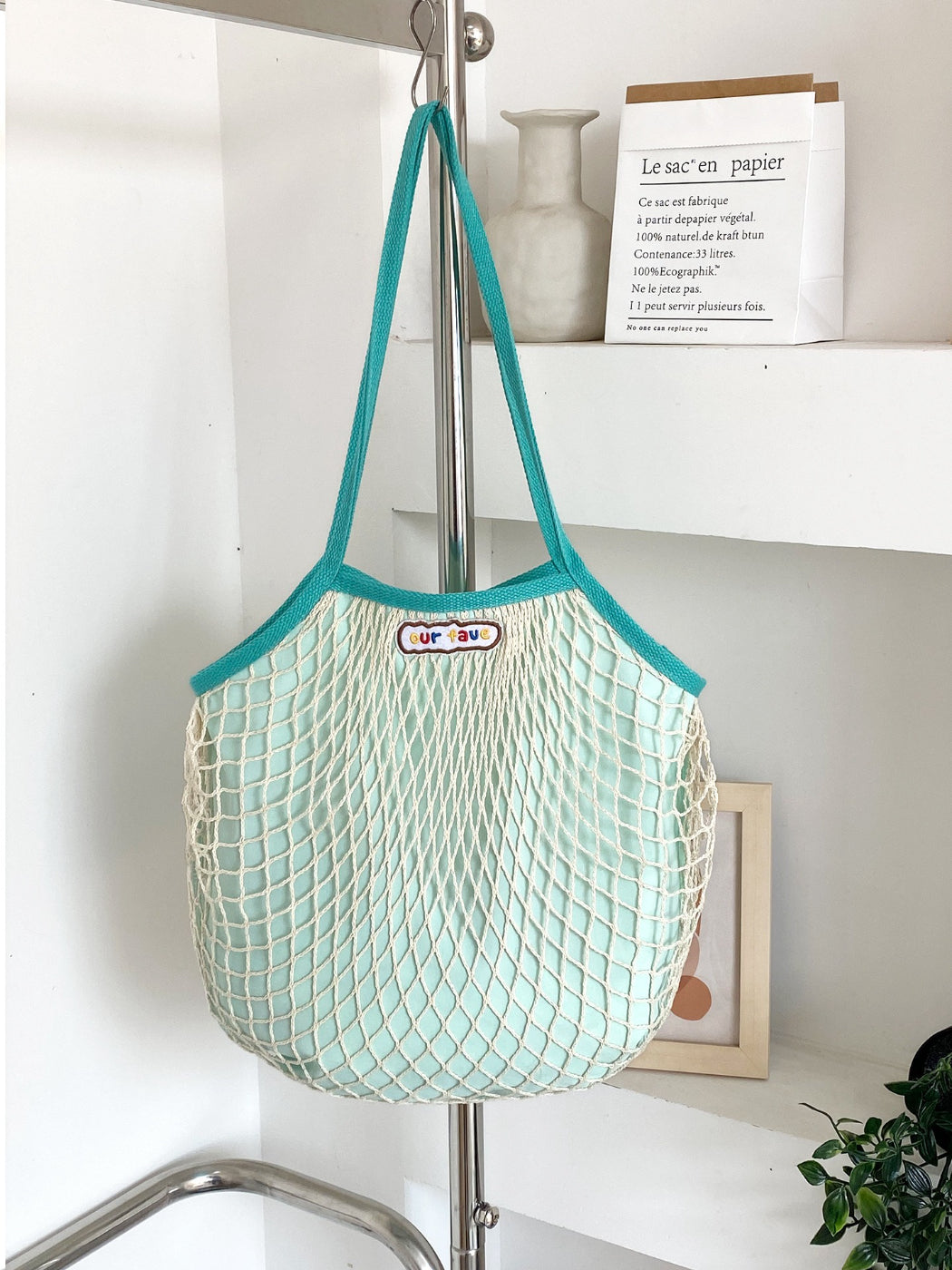 Side view of Cosbai double layer mesh beach tote bag highlighting spacious interior
