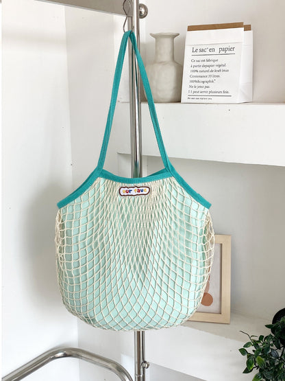 Side view of Cosbai double layer mesh beach tote bag highlighting spacious interior