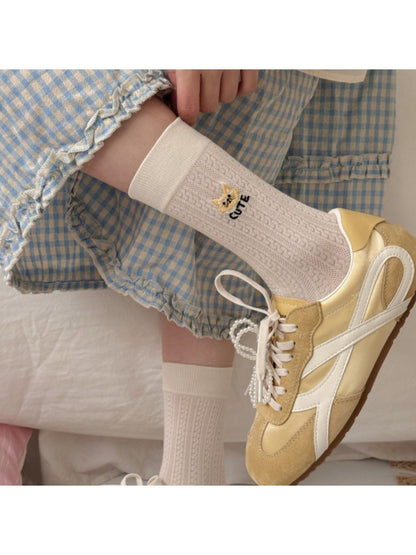 Pair of Rufia soft cat knit crew socks in pastel colors displayed flat
