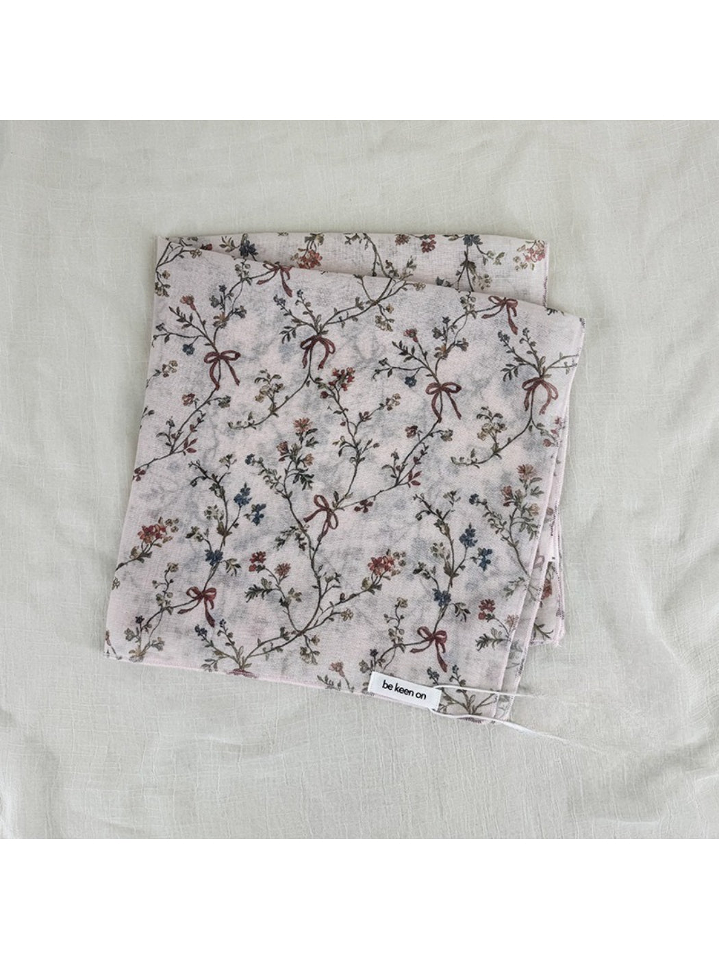 Scarvii vintage floral square scarf styled around a neck with soft draping