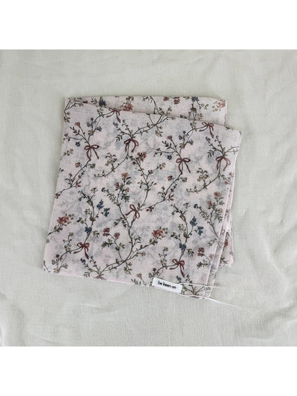 Scarvii vintage floral square scarf styled around a neck with soft draping