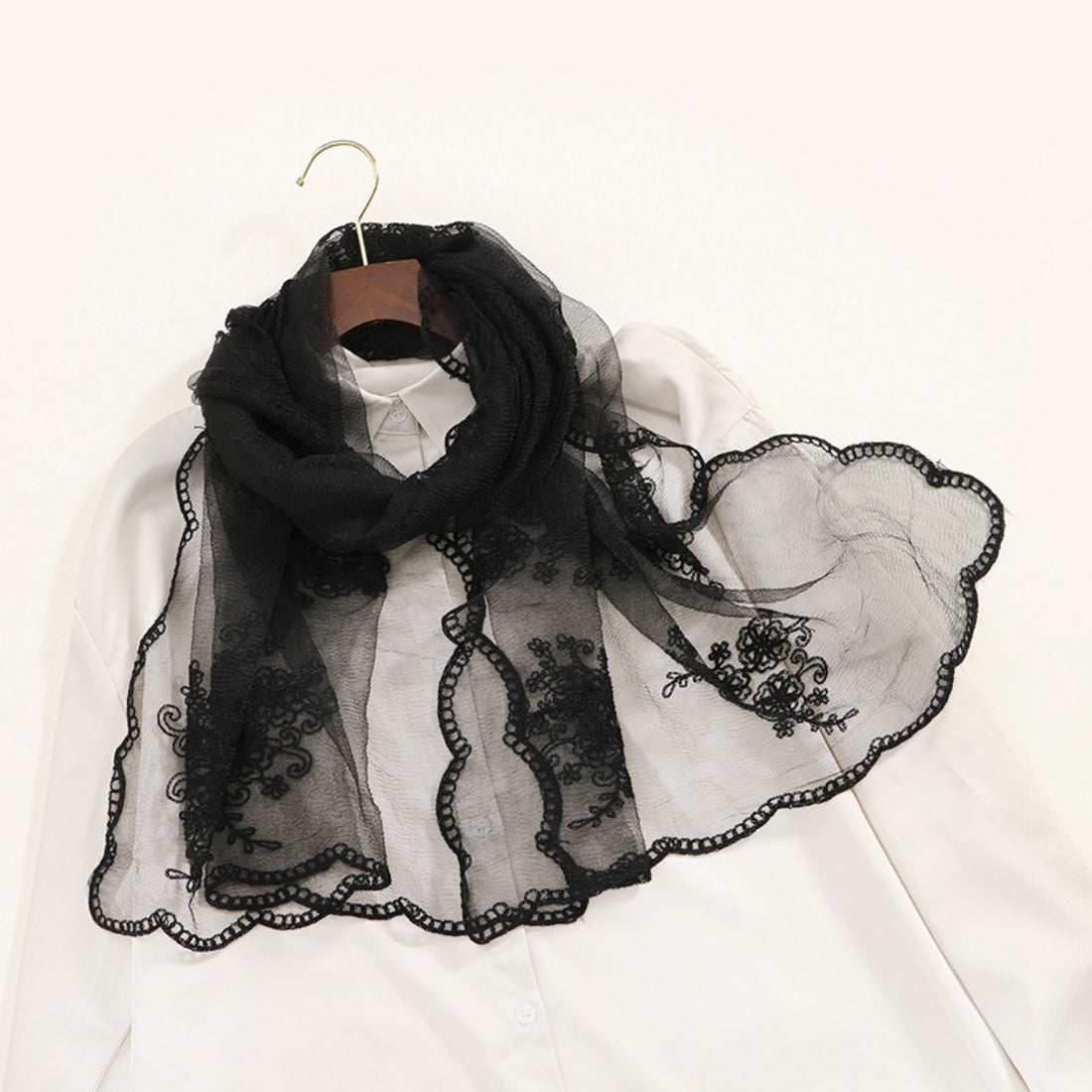 Model wearing Scarvii sheer baroque embroidery scarf styled around the neck