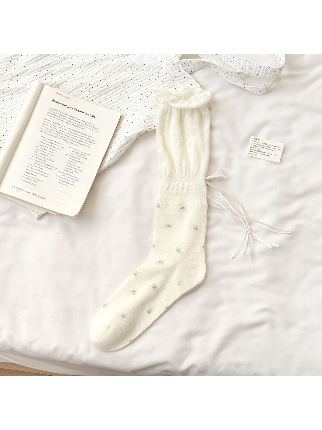 Rufia Soft Bloom Ruffle Crew Socks displayed flat highlighting ruffled cuff and floral print
