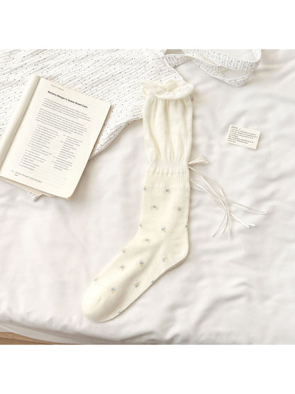 Rufia Soft Bloom Ruffle Crew Socks displayed flat highlighting ruffled cuff and floral print
