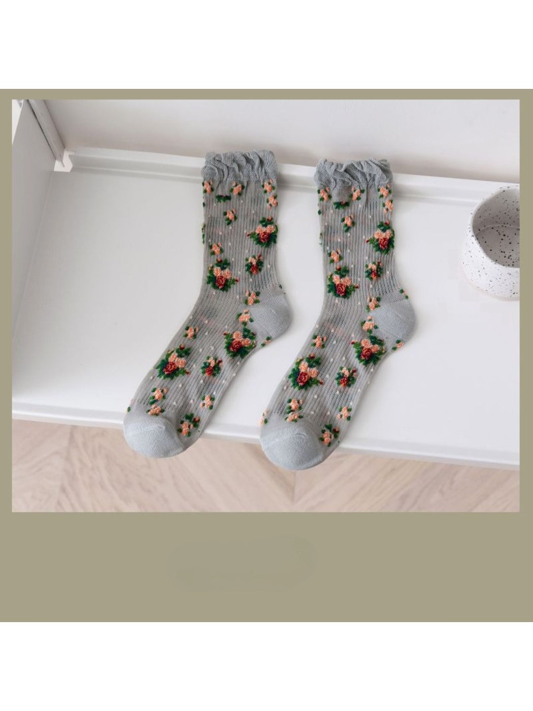 Rufia socks folded to show floral pattern and soft fabric texture