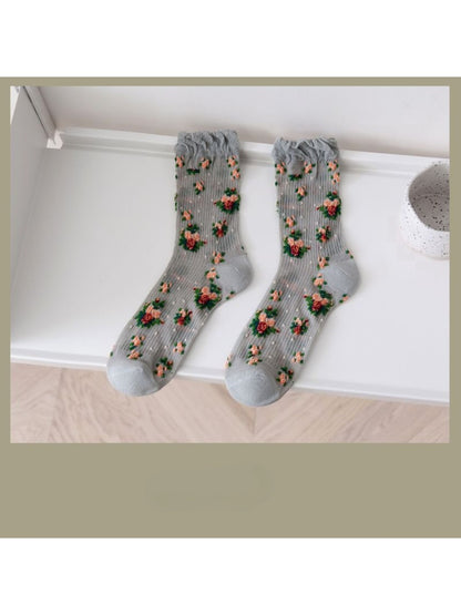 Rufia socks folded to show floral pattern and soft fabric texture