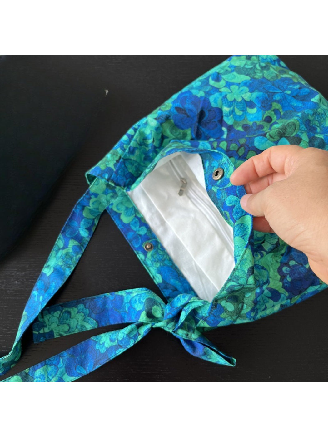 Back view of Cosbai blue floral shoulder bag with visible stitching