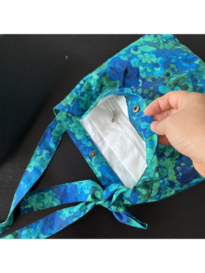 Back view of Cosbai blue floral shoulder bag with visible stitching
