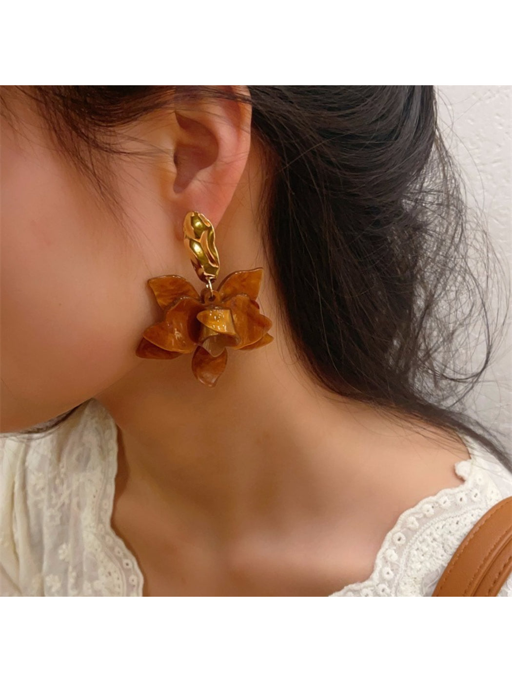 Earwish floral drop earrings displayed on a white background showing detailed petals