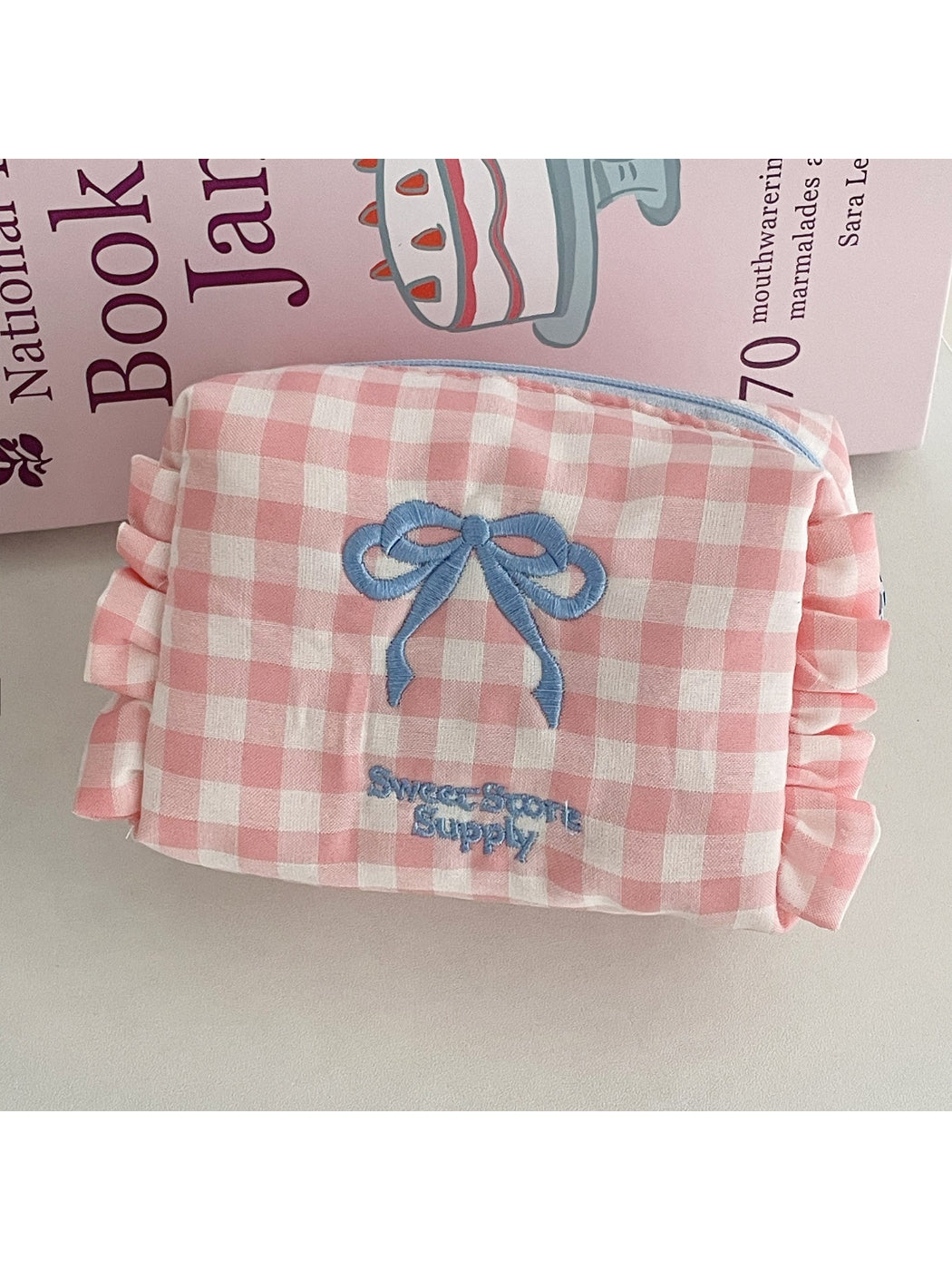 Side view of Cosbai Sweet Check Ruffle Makeup Bag highlighting