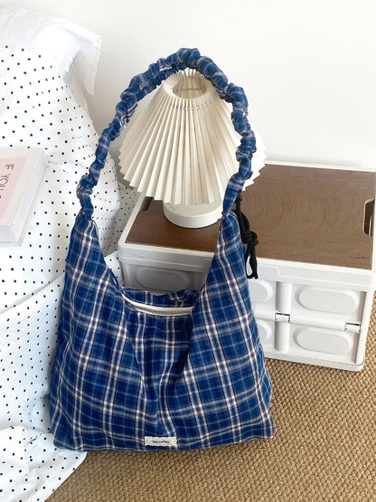 Interior view of Cosbai plaid slouchy shoulder bag showing lining and pocket