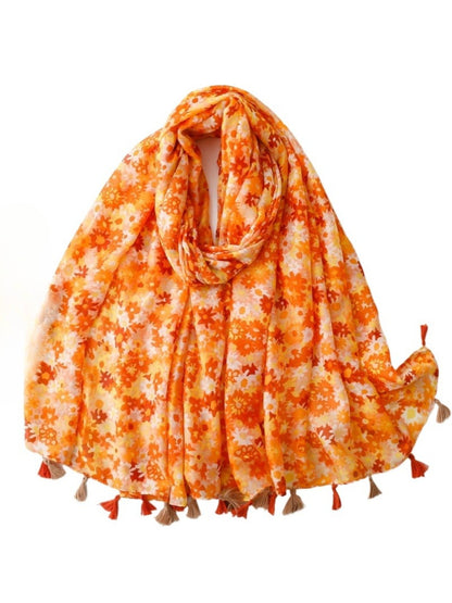 Bright ditsy floral wrap scarf with small colorful flowers on white background